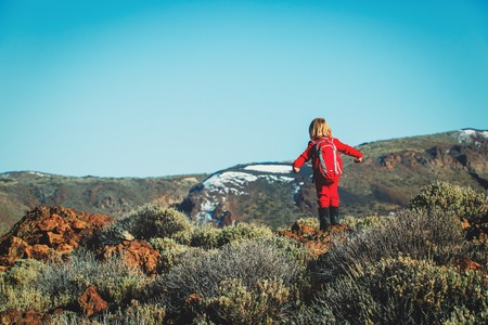 little girl hiking in mountains, family travelの写真素材