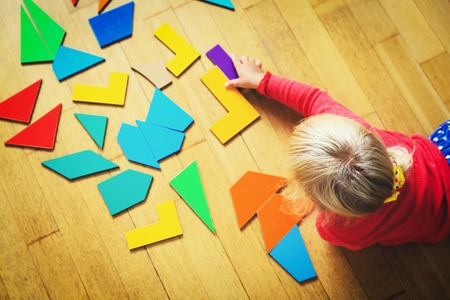little girl playing with puzzle, early educationの写真素材