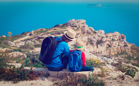 father and son travel in mountainsの写真素材