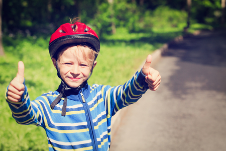 happy little boy loves sport in natureの写真素材