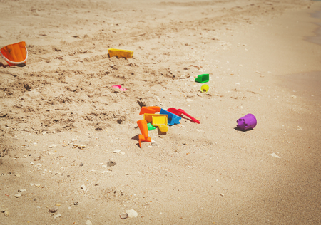 kid toys on tropical sand beachの写真素材