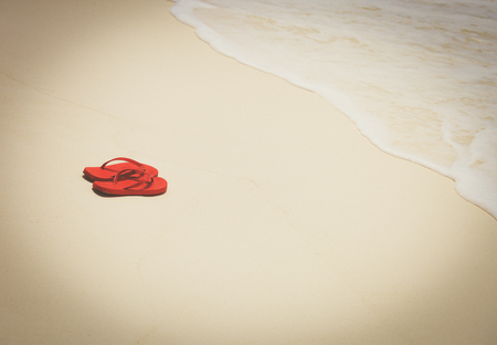 flip flops at sea beachの写真素材