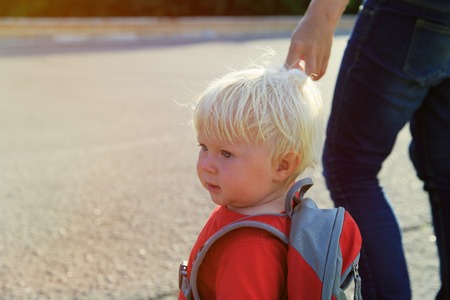 parent walking little daughter to daycareの写真素材