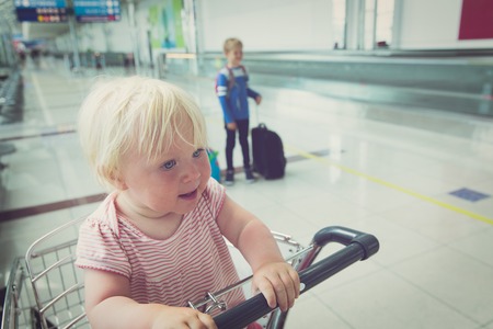 family with kids travel in airportの写真素材