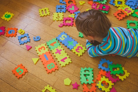 little boy playing with puzzle, education conceptの写真素材