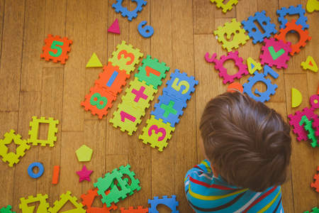 little boy playing with puzzle, education conceptの写真素材