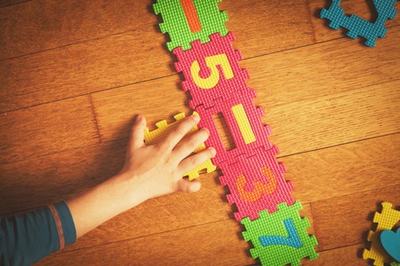 child playing with puzzle, education conceptの写真素材