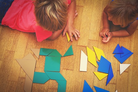 kids playing with puzzle, education conceptの写真素材