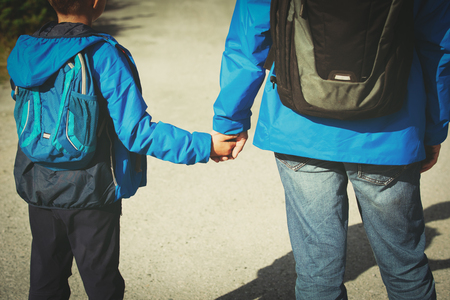 father and son on going to schoolの写真素材
