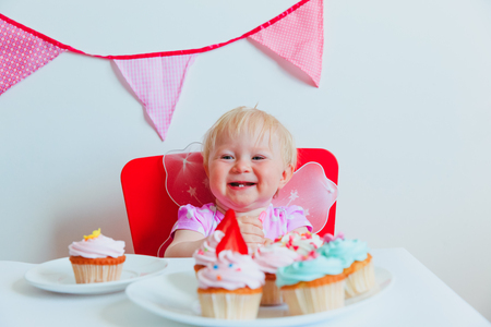 cute happy little angel at first birthday partyの写真素材
