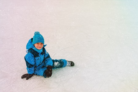 cute little boy enjoy skating in winterの写真素材