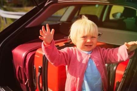 family car travel - little baby and suitcases packedの写真素材