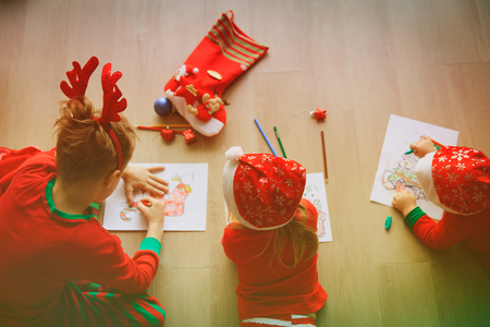 kids making Christmas crafts, family celebrationの写真素材