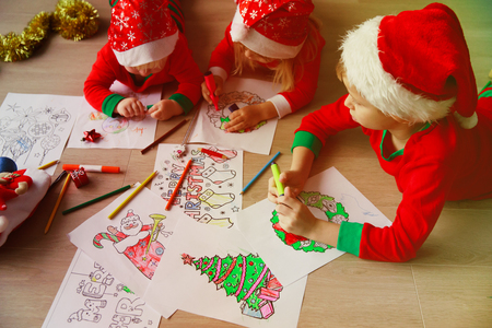 kids making Christmas crafts, family celebrationの写真素材