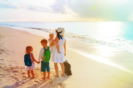 family with kids travel on tropical beachの写真素材