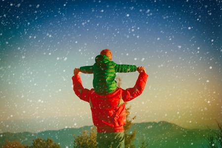 happy father and son play on sky, travel in mountainsの写真素材