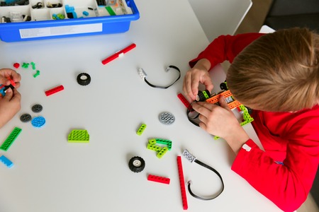 kids building robot at robotic technology school lessonの写真素材
