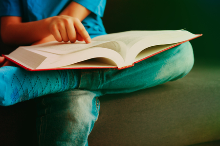 little boy reading bookの写真素材