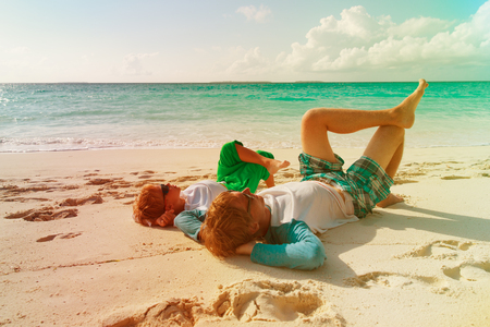 father and son having fun on beachの写真素材