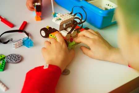 kids building robot at robotic technology school lessonの写真素材