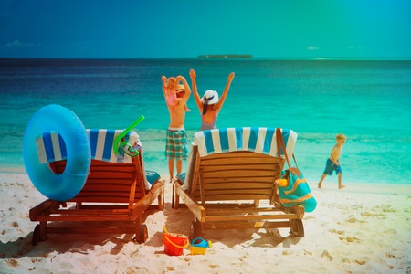 happy family with two kids on beach vacationの写真素材