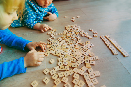 kids play with letter puzzle in school or daycareの写真素材