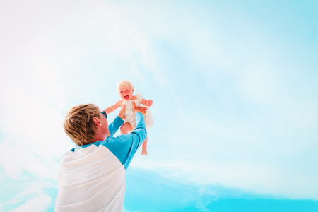 father and happy little daughter play at skyの写真素材