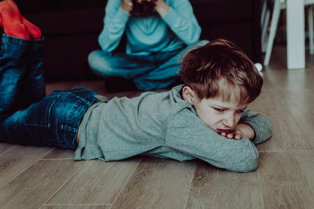 angry stressed child and tired fatherの写真素材