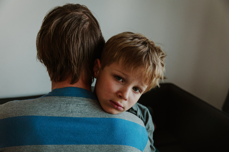 Father comforting sad child, parenting, sorrowの写真素材