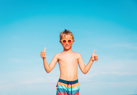 happy little boy enjoy tropical beachの写真素材