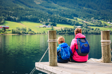 mother and son travel in nature, looking at viewの写真素材
