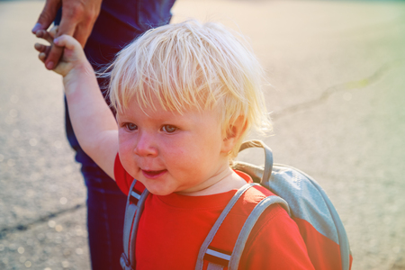parent walking little daughter to daycareの写真素材