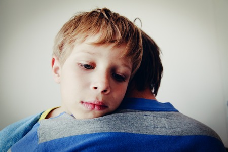 Father comforting sad child, parenting, sorrow conceptの写真素材