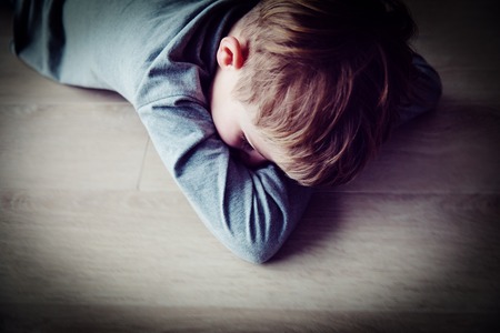 crying stressed tired exhausted child, despair, frustrationの写真素材