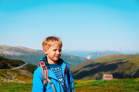 happy little boy hiking travel in natureの写真素材