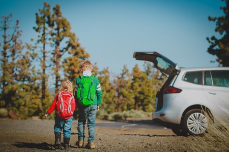 family car travel -little boy and girl get ready for hikingの写真素材
