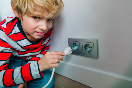 little boy play with electricity, kids safetyの写真素材