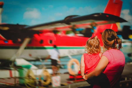 mother and little daughter waiting for seaplane