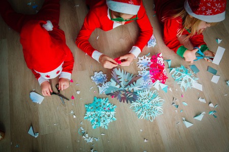 kids making snowflakes from paper, Christmas craftsの写真素材