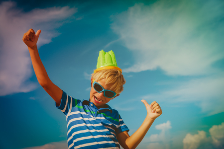 happy boy play with toys on beachの写真素材