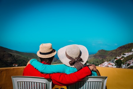 happy couple on vacation near sea and mountainsの写真素材