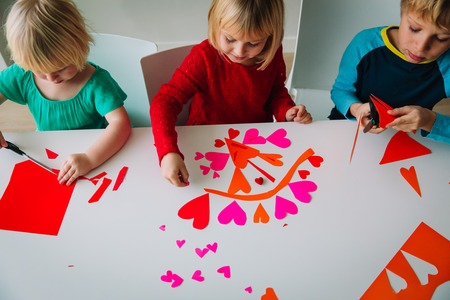kids making hearts from paper, prepare for valentine dayの写真素材