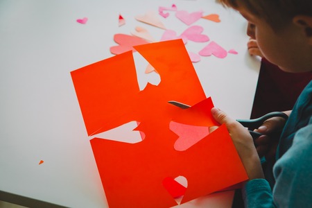kids making hearts from paper, prepare for valentine dayの写真素材