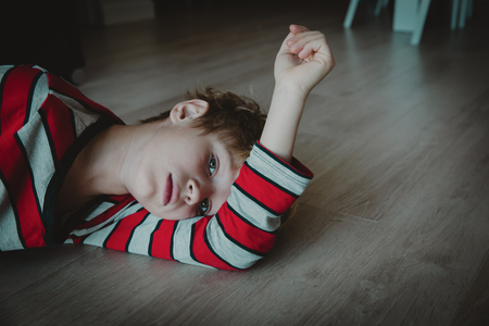 sad young boy, kids stress and exhaustionの写真素材