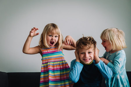 kids shouting, brother and sisters tired of staying home, family problemsの写真素材