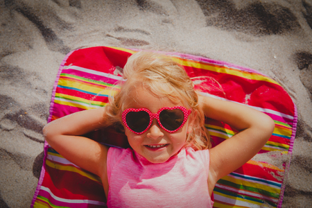 happy cute little girl smile on beach vacationの写真素材
