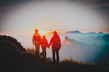 mother with kids travel in sunset mountainsの写真素材