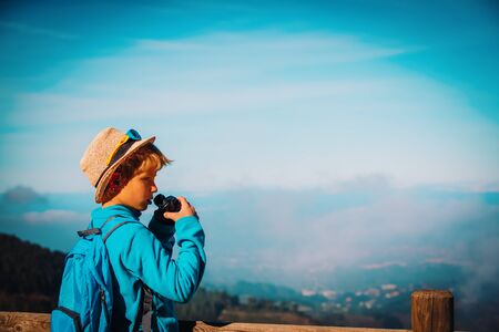 young boy hiking in mountains, family travelの写真素材