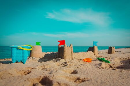 Sand castle on beach vacation and toysの写真素材