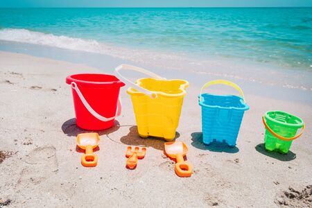 kid toys on tropical sand beach, family vacationの写真素材